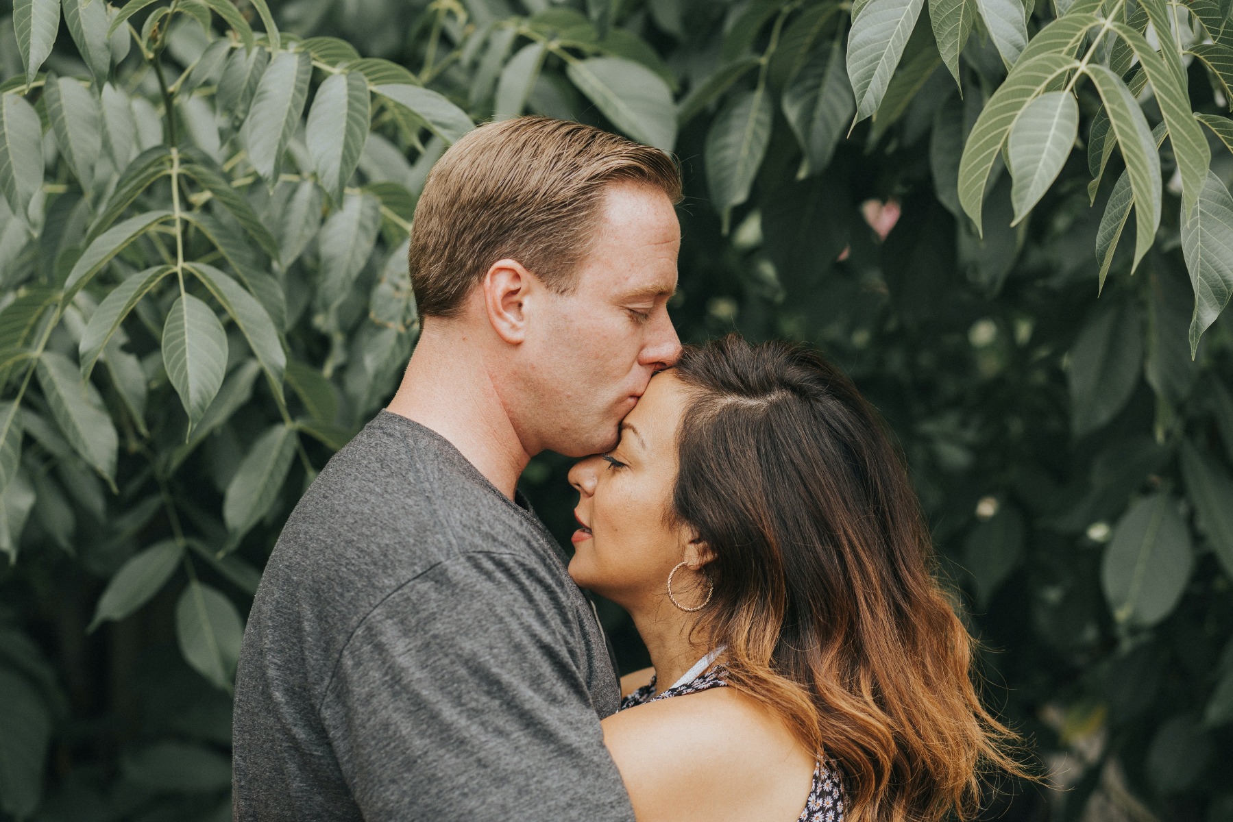 A man and woman embracing each other. 