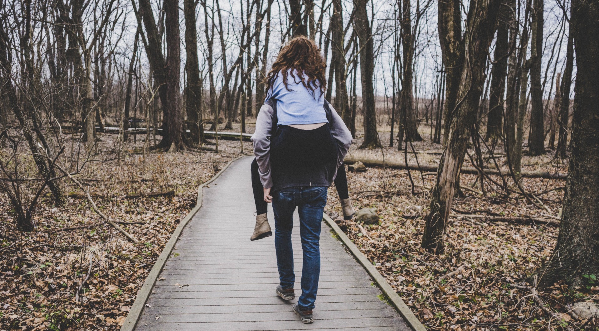 A woman on a mans back 